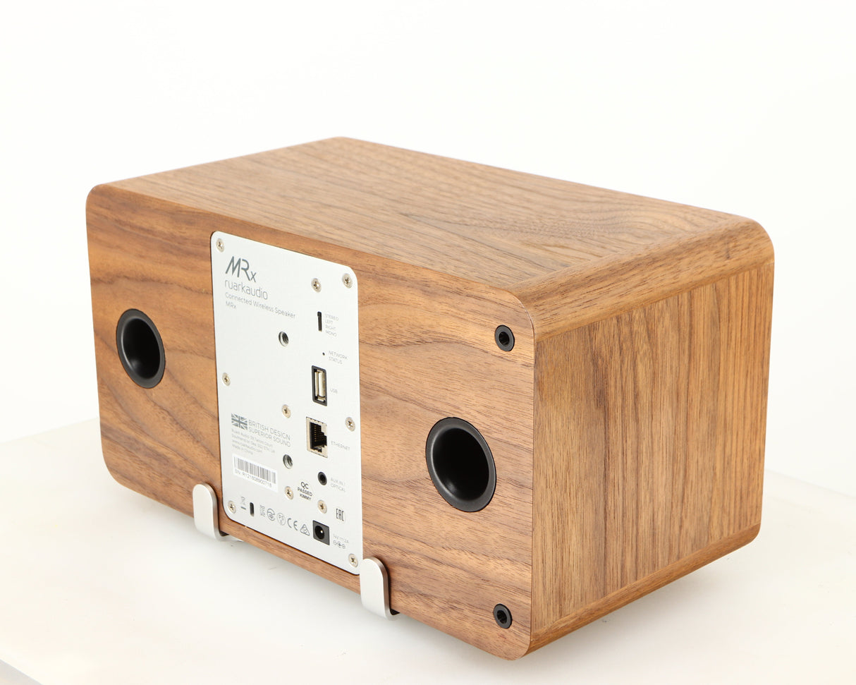 Rear left corner of a used Ruark MRX Wireless Speaker in a walnut finish