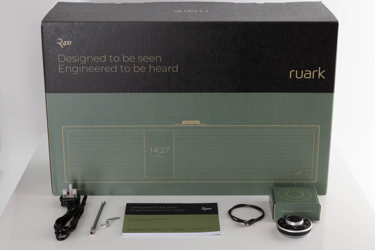 Box of a used Ruark R410 Integrated Music System in Fused Walnut with mains cable, manual, remote, USB-C cable, and antenna