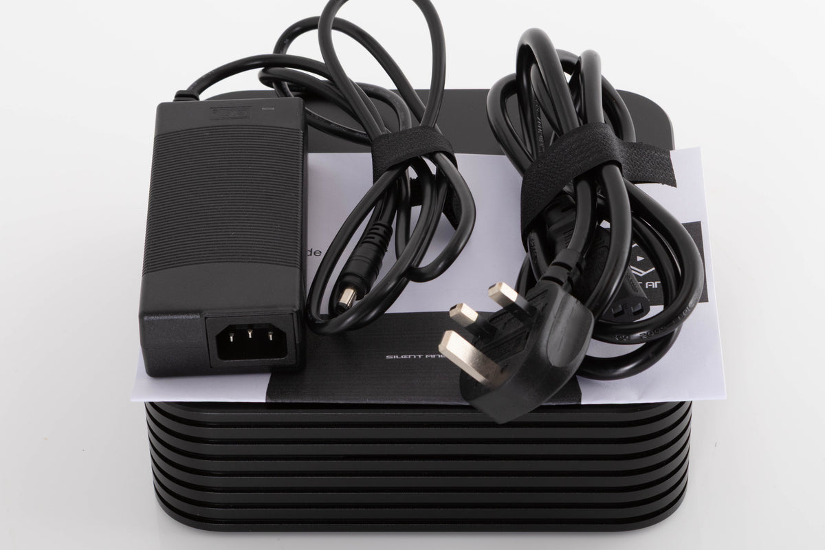 Top of a used Silent Angel Rhein Z1 Plus Streamer in a Black finish showing Mains Cable, PSU and Manual