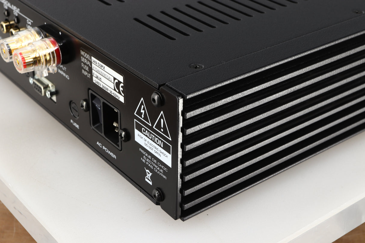 Rear left corner of a used Simaudio Moon 340i D3PX Integrated Amplifier in a black finish