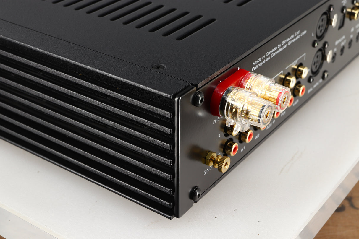 Rear right corner of a used Simaudio Moon 340i D3PX Integrated Amplifier in a black finish