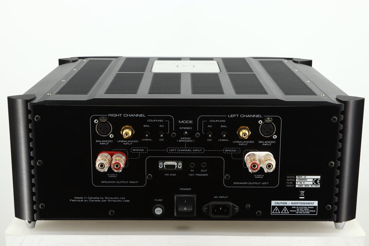 Rear view of a used Simaudio Moon 860A V2 Power Amplifier in black finish showing mains input, speaker inputs, balanced XLR, and RS 232