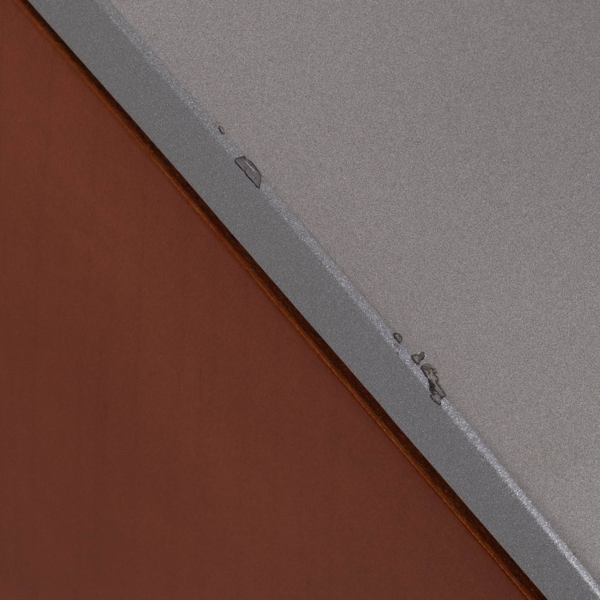 Close up of a used Sony SS-X90ED Floorstanding Speaker in a Silver / Cherry finish showing small blemishes on top edge