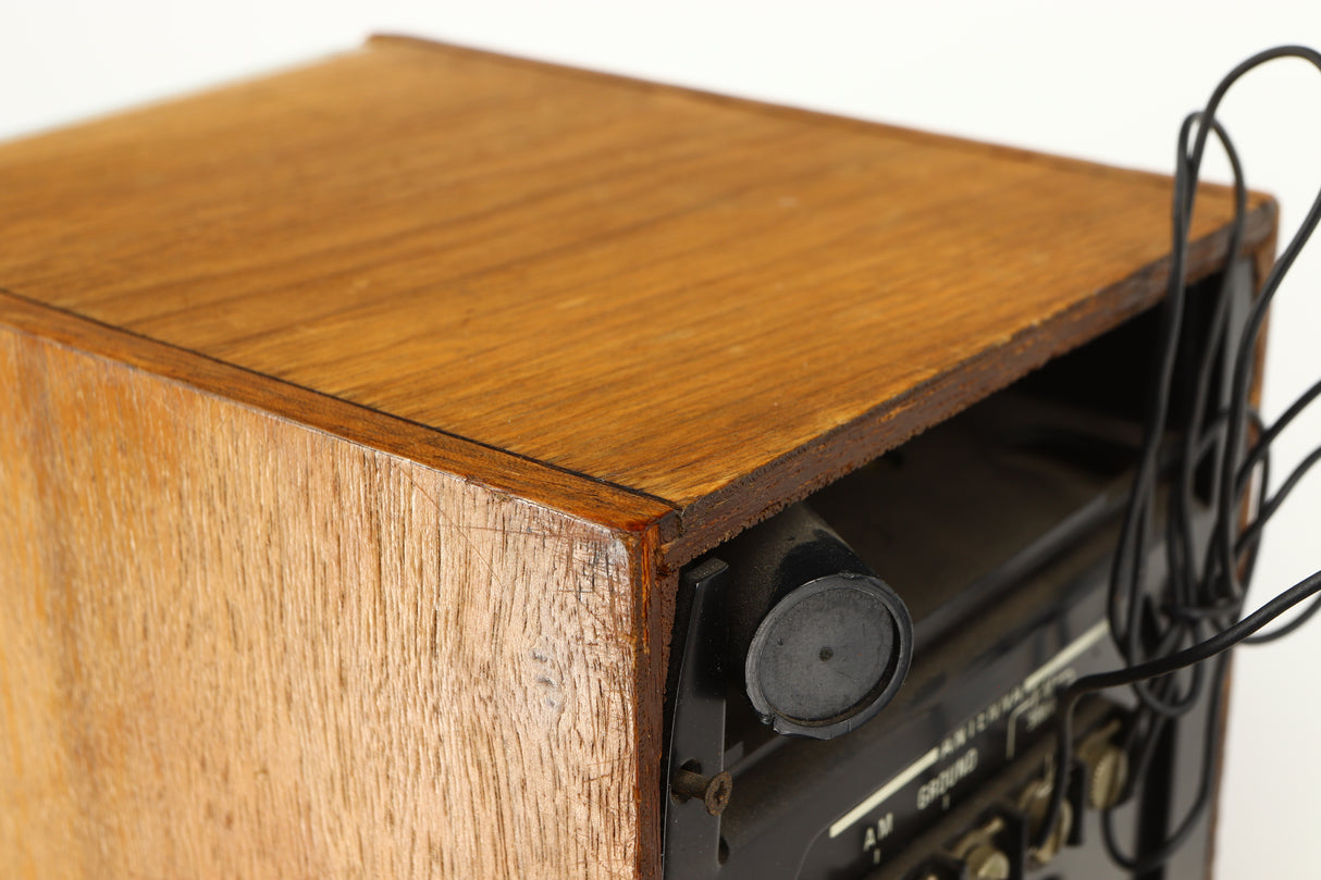Close up of a used Sony ST-88 Tuner in an oak finish showing some damage on rear right corner