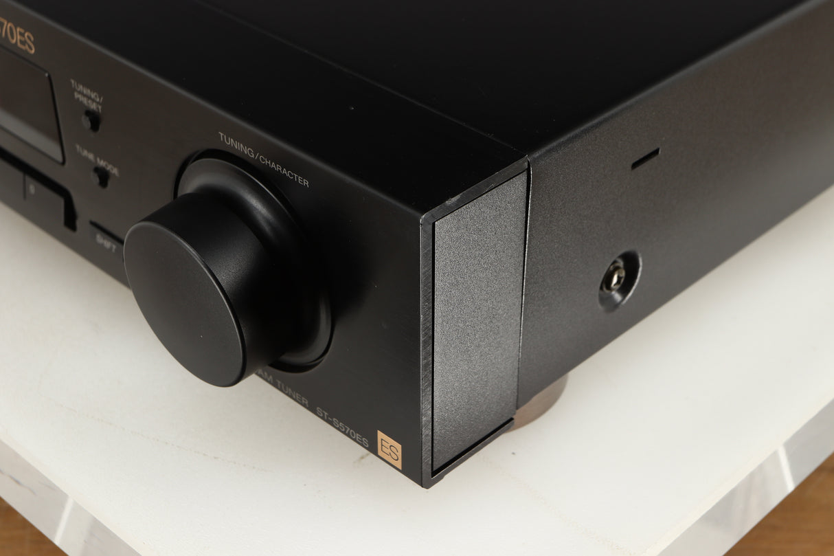 Front right corner of a used Sony ST-S570ES FM/AM Tuner in a black finish