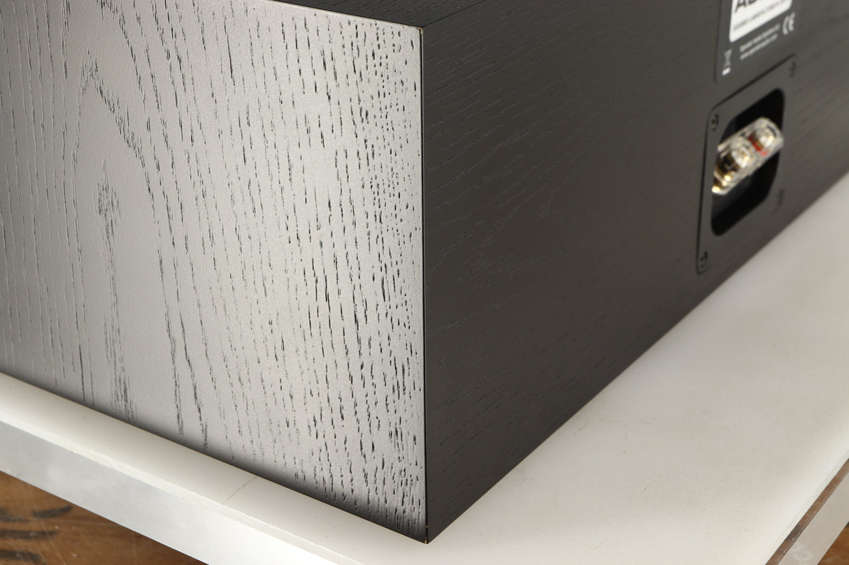 Rear right corner of a used Spendor AC2 Centre Speaker in a black oak finish