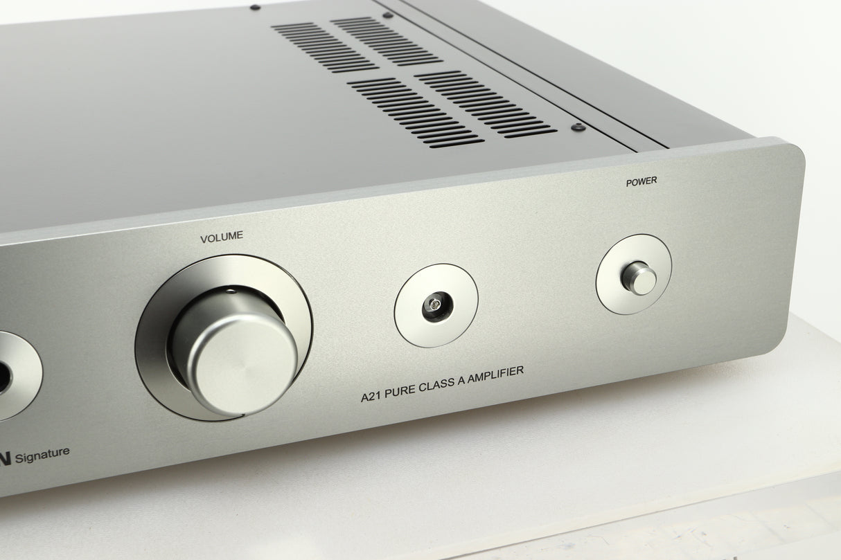 Close up view of a used Sugden A21 I-S Integrated Amplifier in Titanium finish showing the right side of the fascia