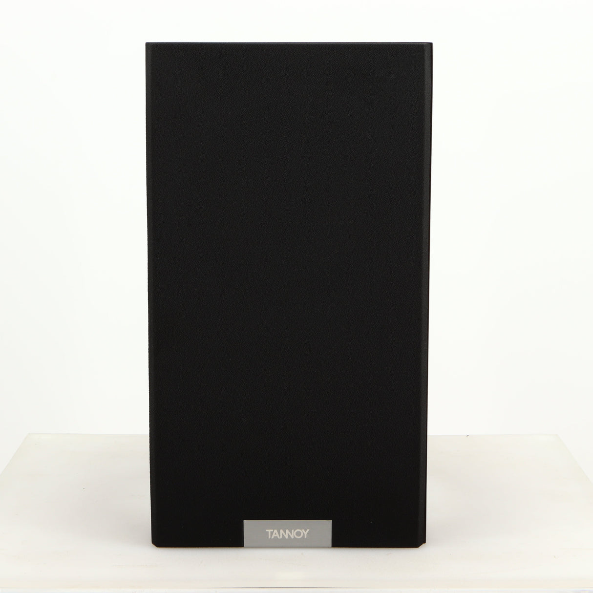 Front view of a used Tannoy Revolution DC6SE Standmount Speaker in an espresso finish showing Grille