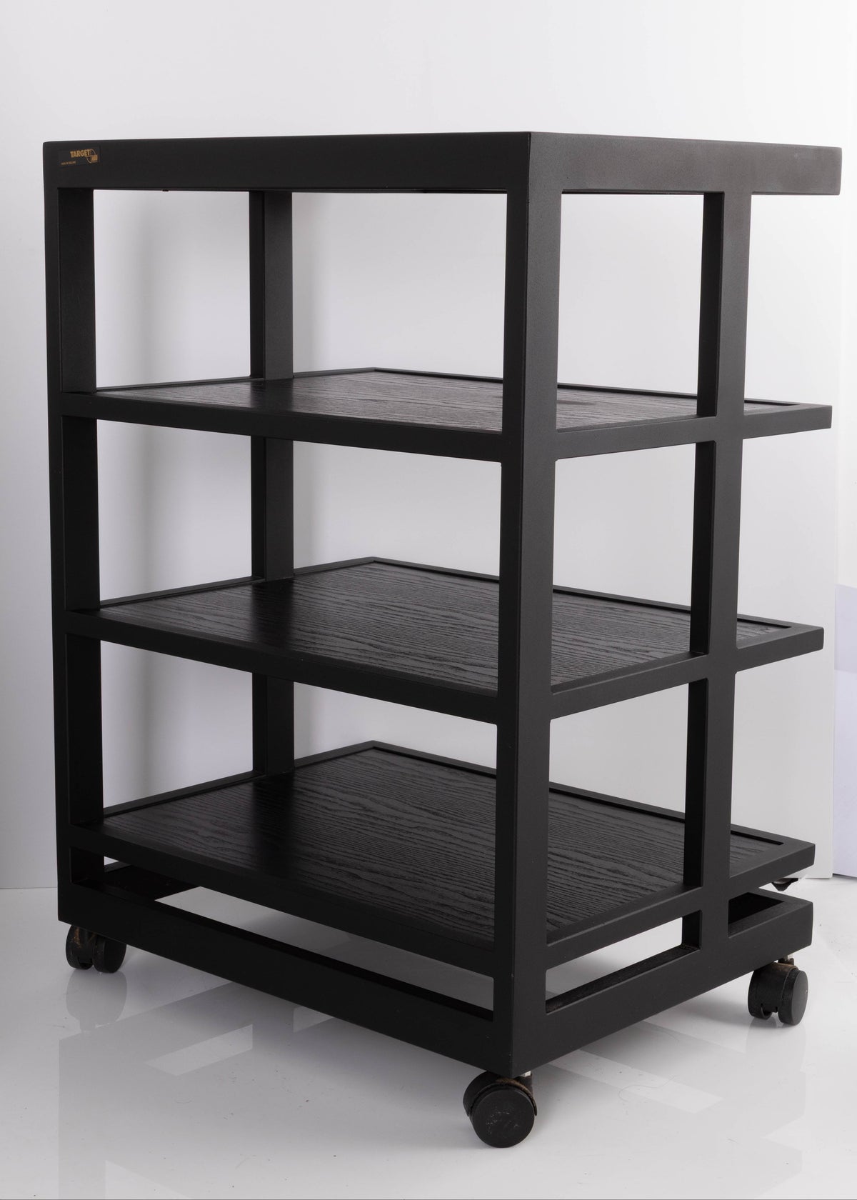Rear left corner of a used Target 3 Shelf Hifi Stand W/ Castors in a Black finish
