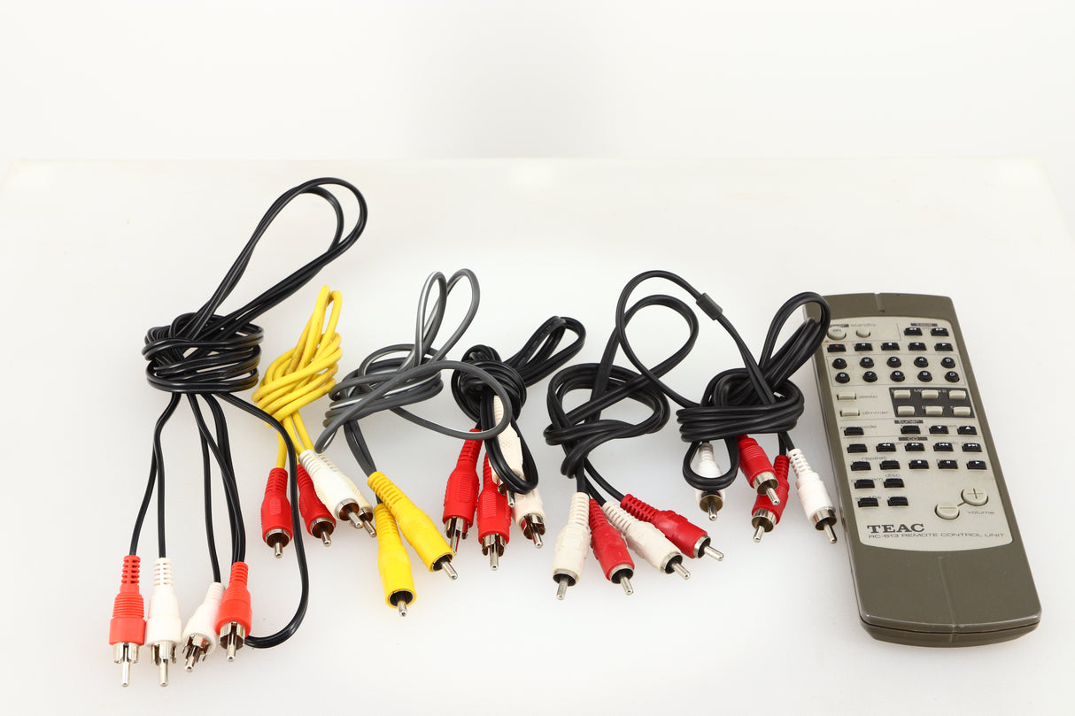 Accessories for a used Teac 500 Midi Hifi Stacking System in a silver finish showing Interconnect Cables and Remote