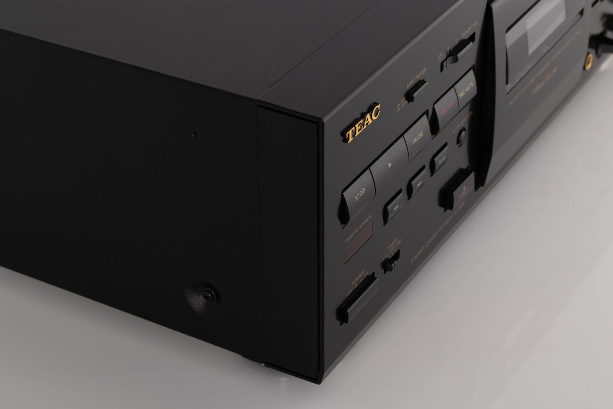 Front left corner of a used TEAC V-1050 Cassette Deck in a Black finish