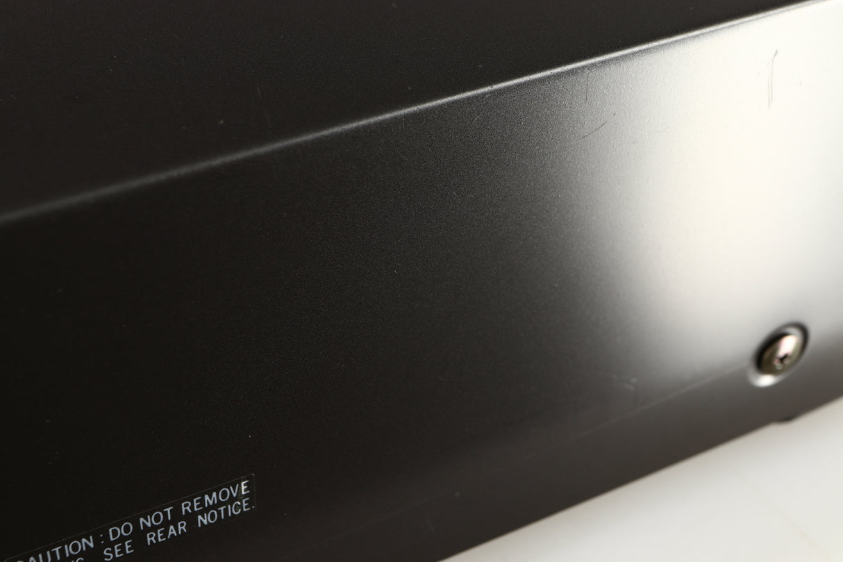Close up of a used Technics RS-B205 Cassette Deck showing some scratching on left side