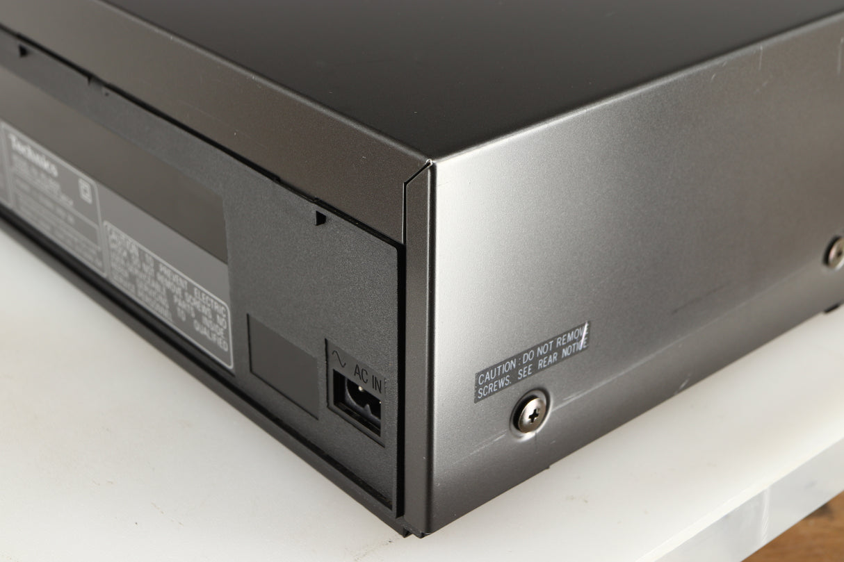 Rear left corner of a used Technics RS-B205 Cassette Deck