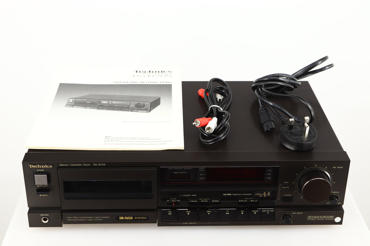Top of a used Technics RS-B705 Cassette Deck in a black finish showing Manual, Power Cable and Interconnect Cable
