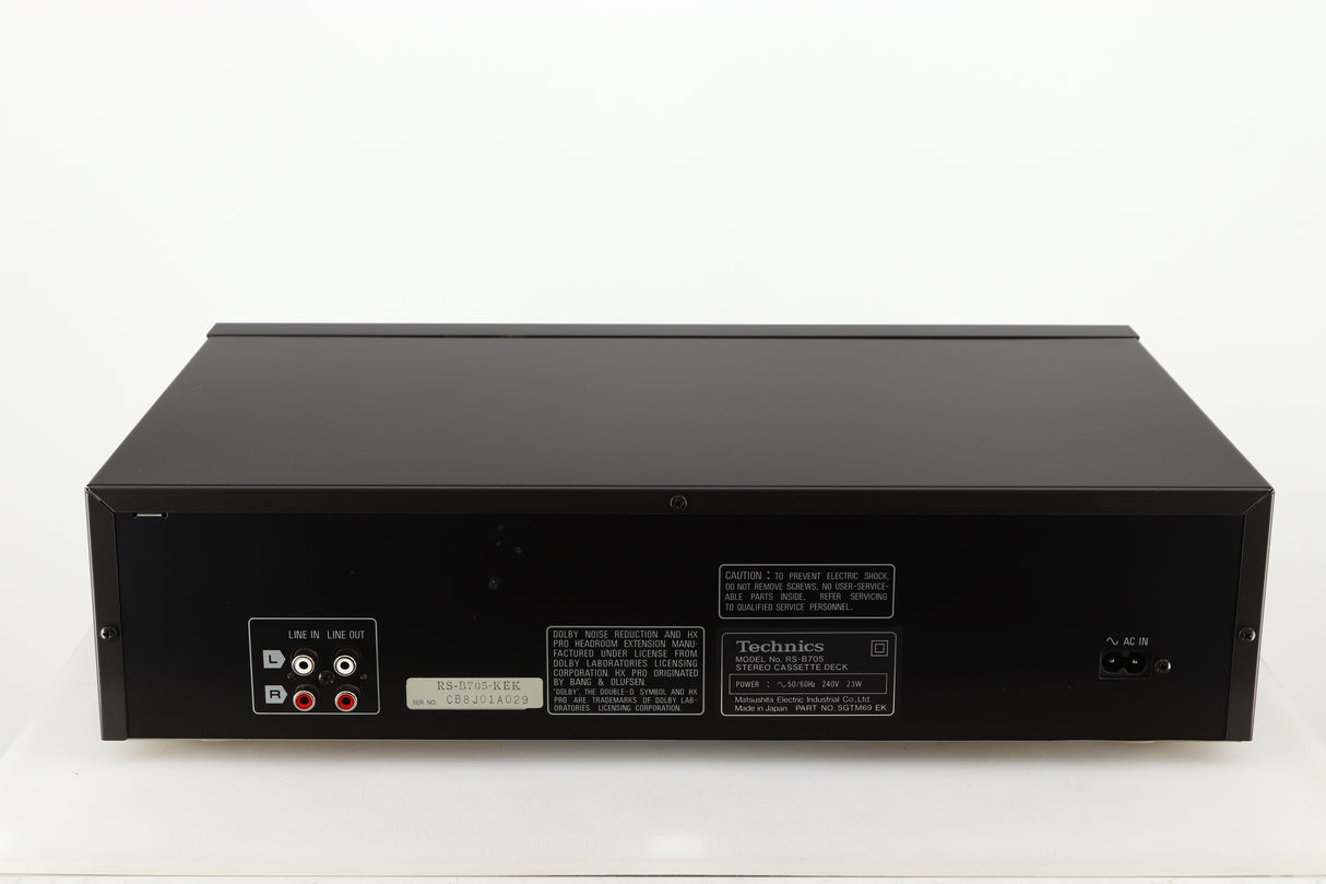 Rear view of a used Technics RS-B705 Cassette Deck in a black finish showing Phono Inputs and Outputs and Power Input