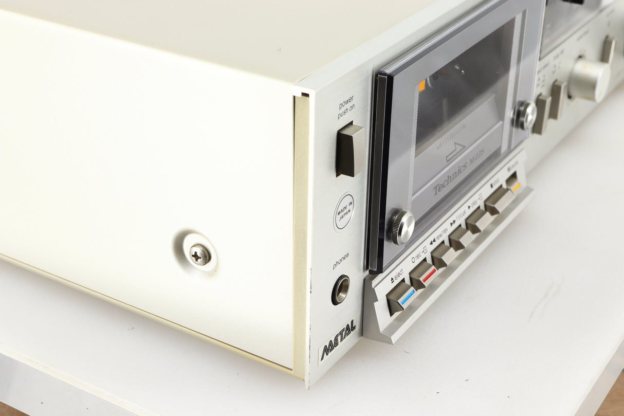 Front left corner of a used Technics RS-M225 Cassette Deck in a silver finish