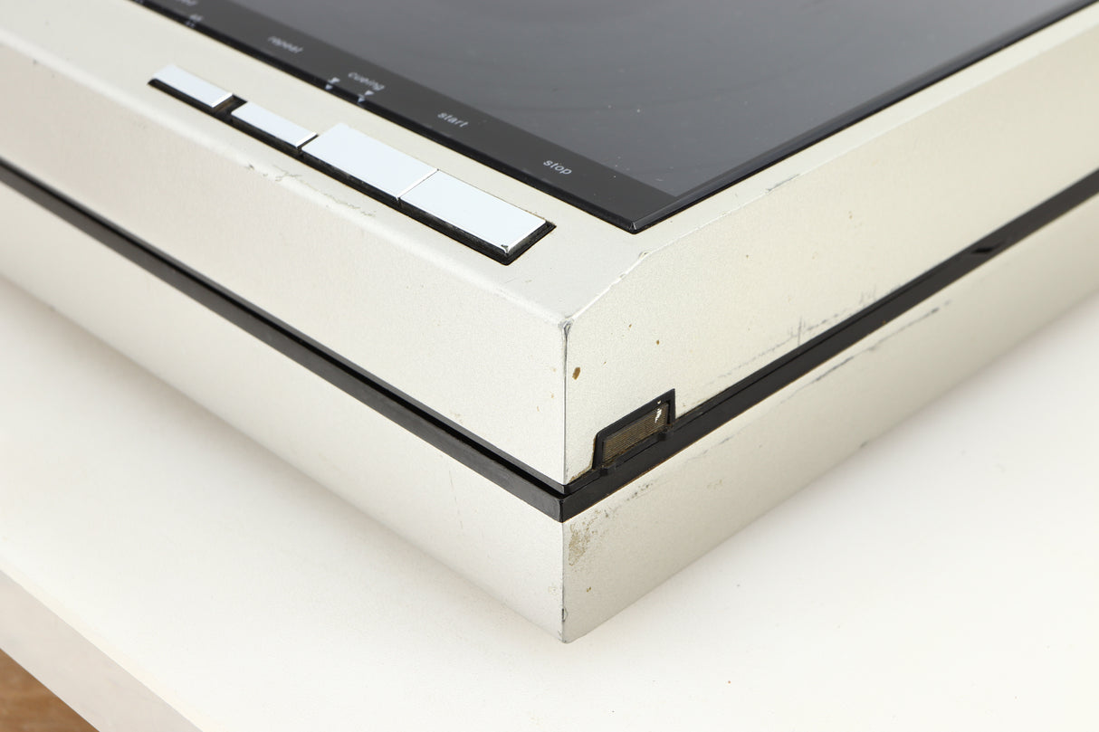 Front right corner of a used Technics SL-10 Turntable in a silver finish