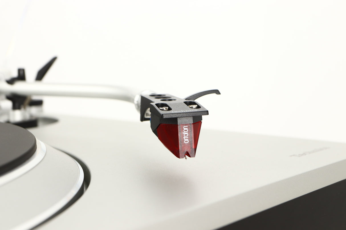 Close up of a used Technics SL-1500C Turntable in a silver finish showing stylus