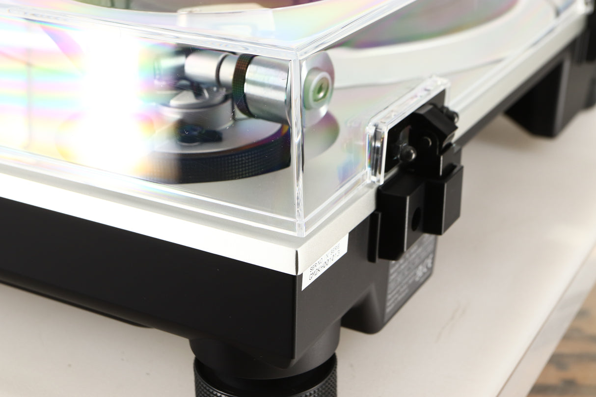 Rear right corner of a used Technics SL-1500C Turntable in a silver finish