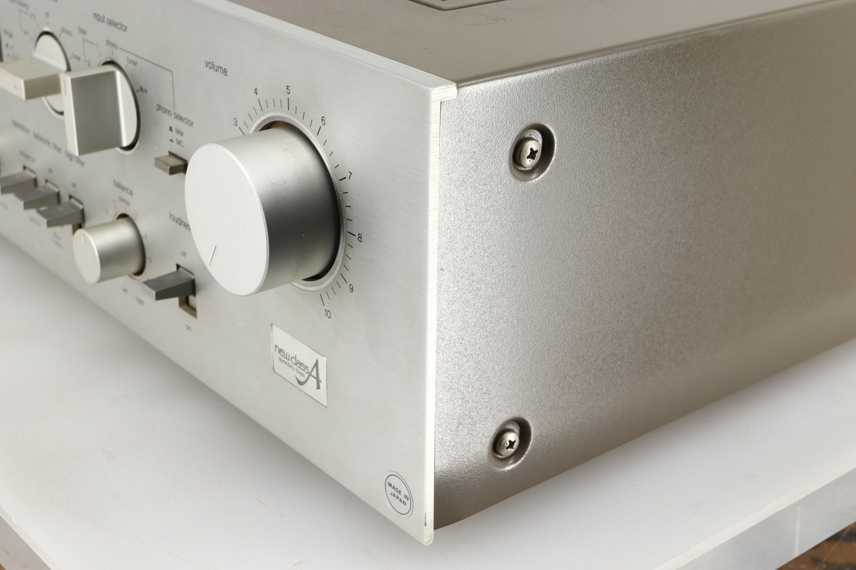 Front right corner of a used Technics SU-V4 Integrated Amplifier in a silver finish