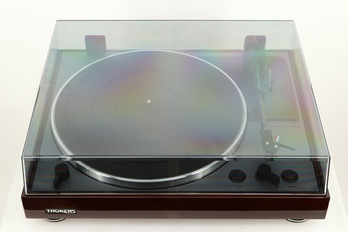 Top view of a used Thorens TD-102A Turntable in Walnut finish showing lid