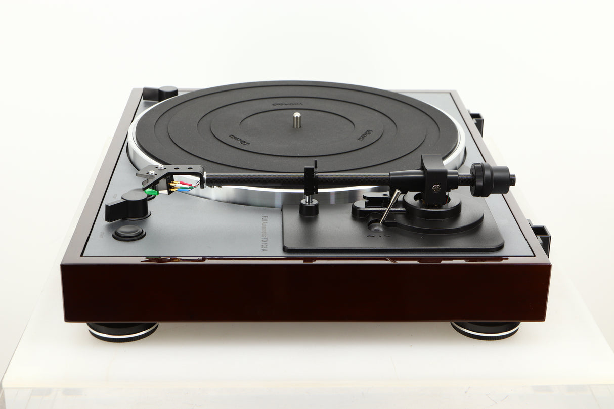 Side view of a used Thorens TD-102A Turntable in Walnut finish