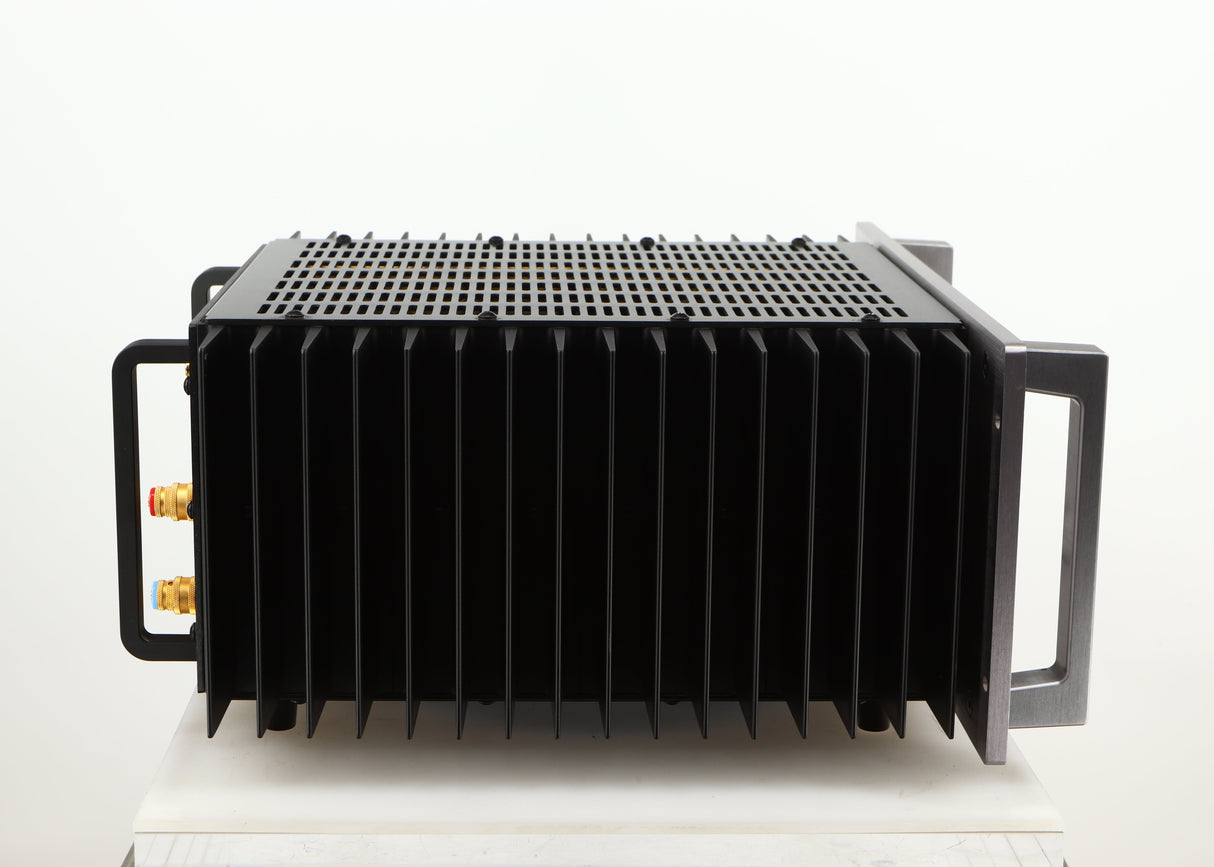 Left side view of a used Usher R1.5 Power Amplifier in a silver finish