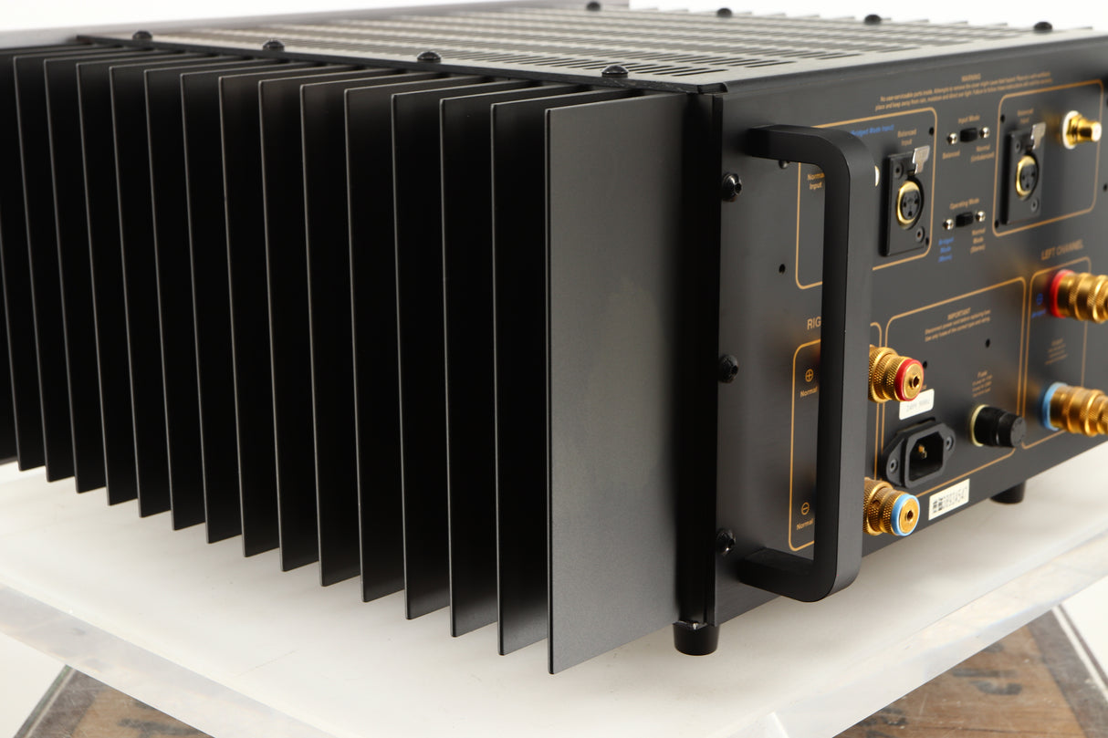 Rear right corner of a used Usher R1.5 Power Amplifier in a silver finish