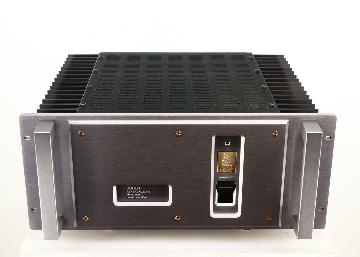 Top of a used Usher R1.5 Power Amplifier in a silver finish