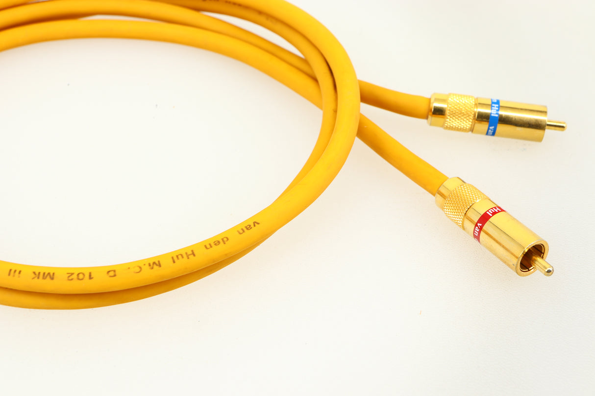 Close up of a used Van Den Hul D-102 MKIII Interconnect 0.8m Cable in a yellow finish showing the connectors