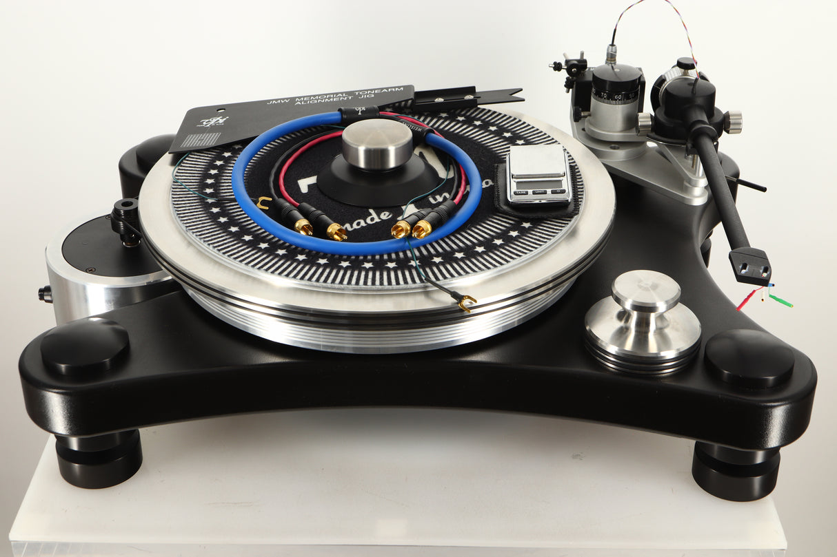 Front view of a used VPI Prime Turntable, interconnects, scale, alignment jig, and record clamp
