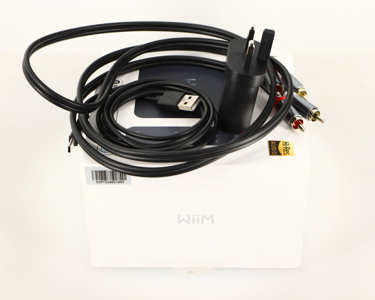 Box for a used Wiim Pro Plus Streamer in a black finish showing USB Cable, Mains Plug and Interconnect Cable