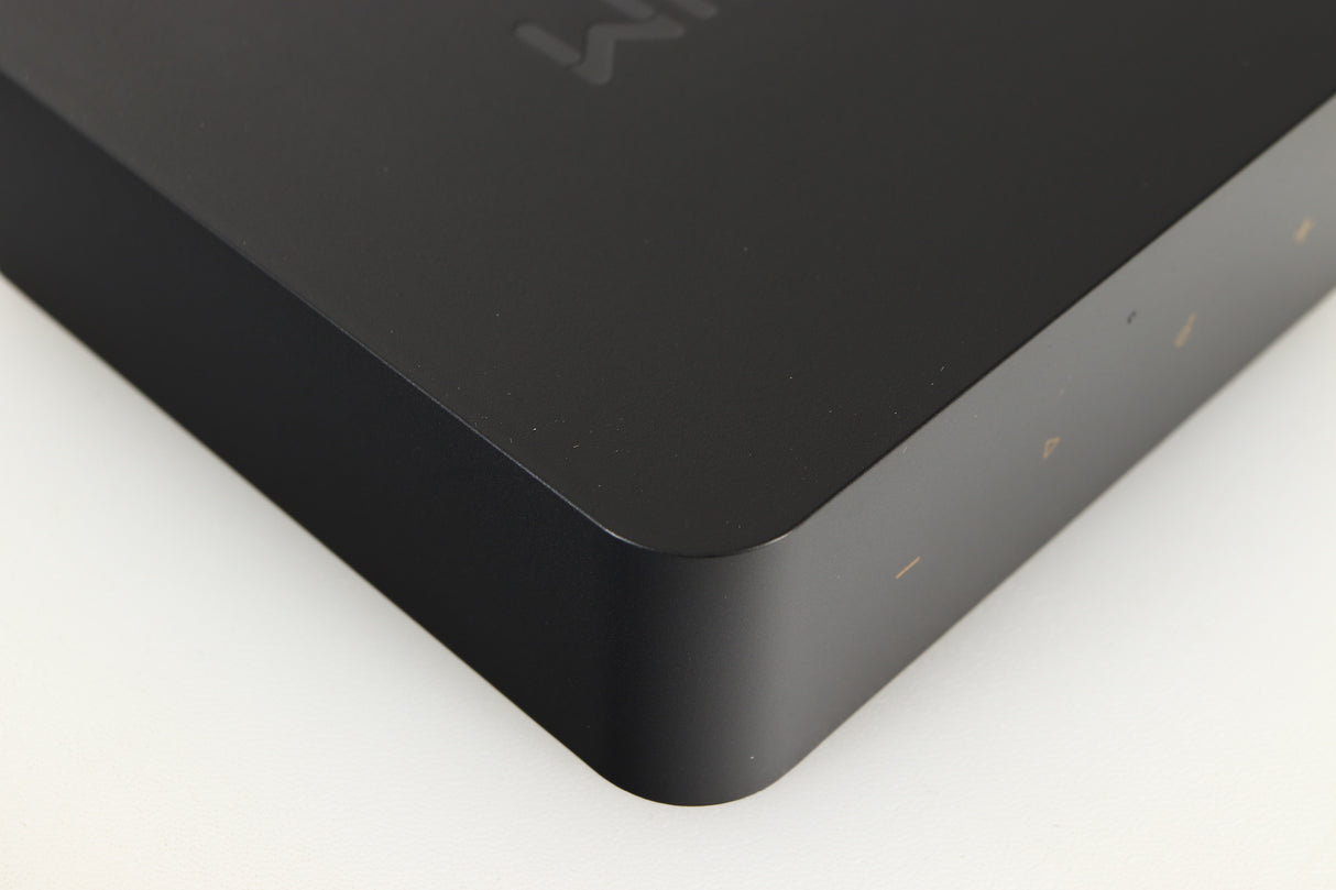 Close up of a used Wiim Pro Plus Streamer in a black finish showing light scratches on left side