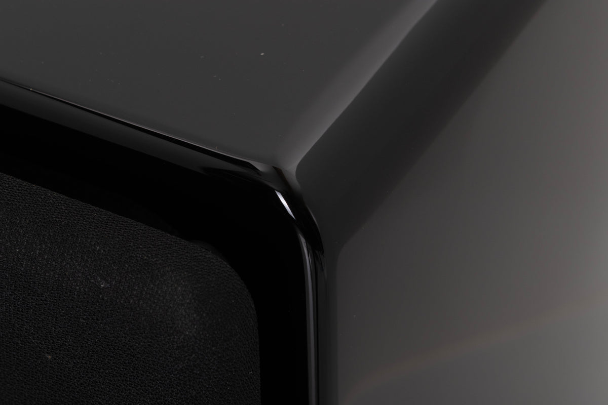 Front right corner of a used XTZ SA-1 Subwoofer in a Gloss Black finish