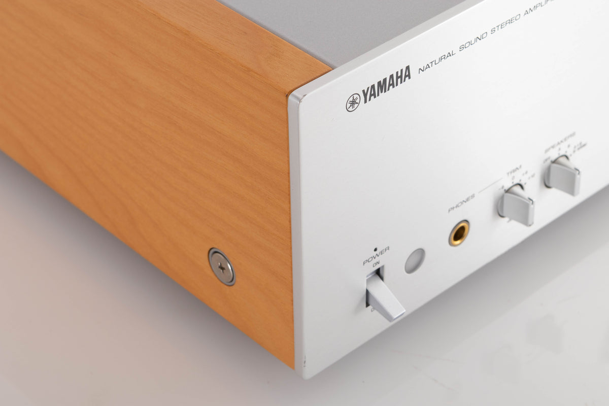 Front left corner of a used Yamaha A-S2000 Integrated Amplifier in a Silver finish