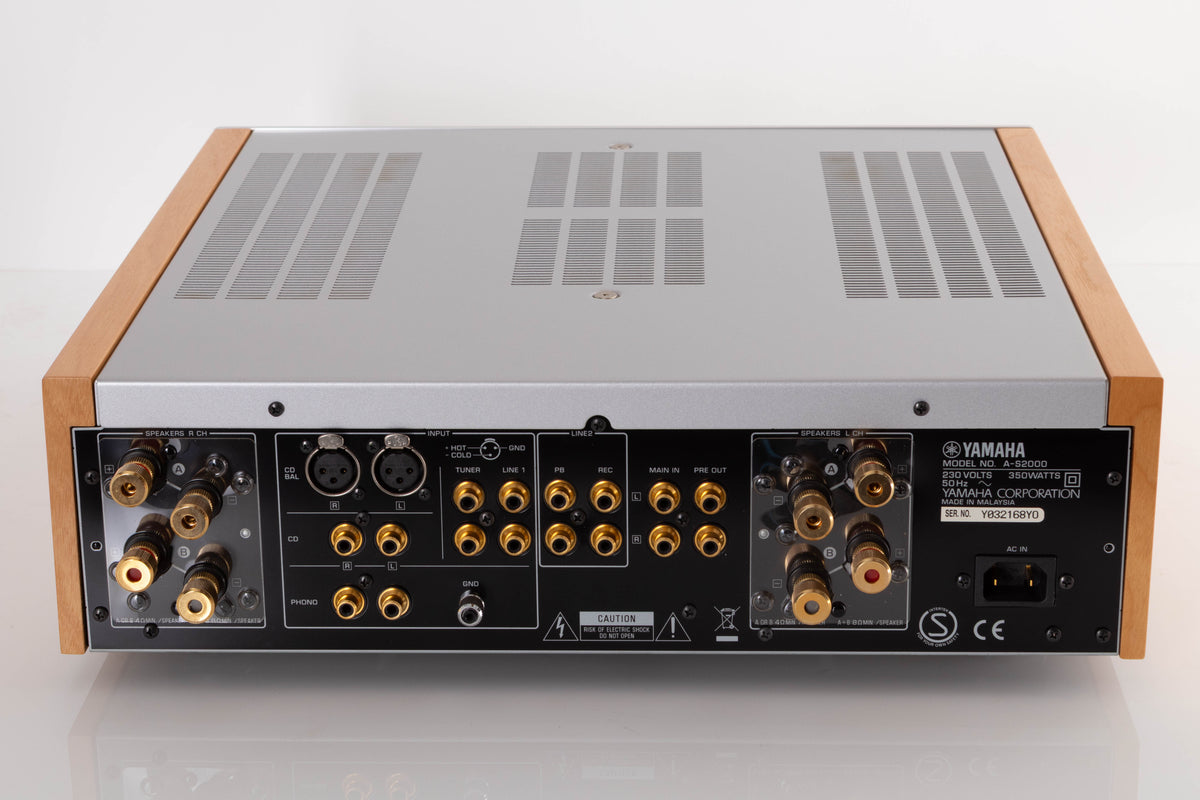 Rear view of a used Yamaha A-S2000 Integrated Amplifier in a Silver finish showing Phono Inputs, Phono Outputs, XLR Inputs and Mains Input