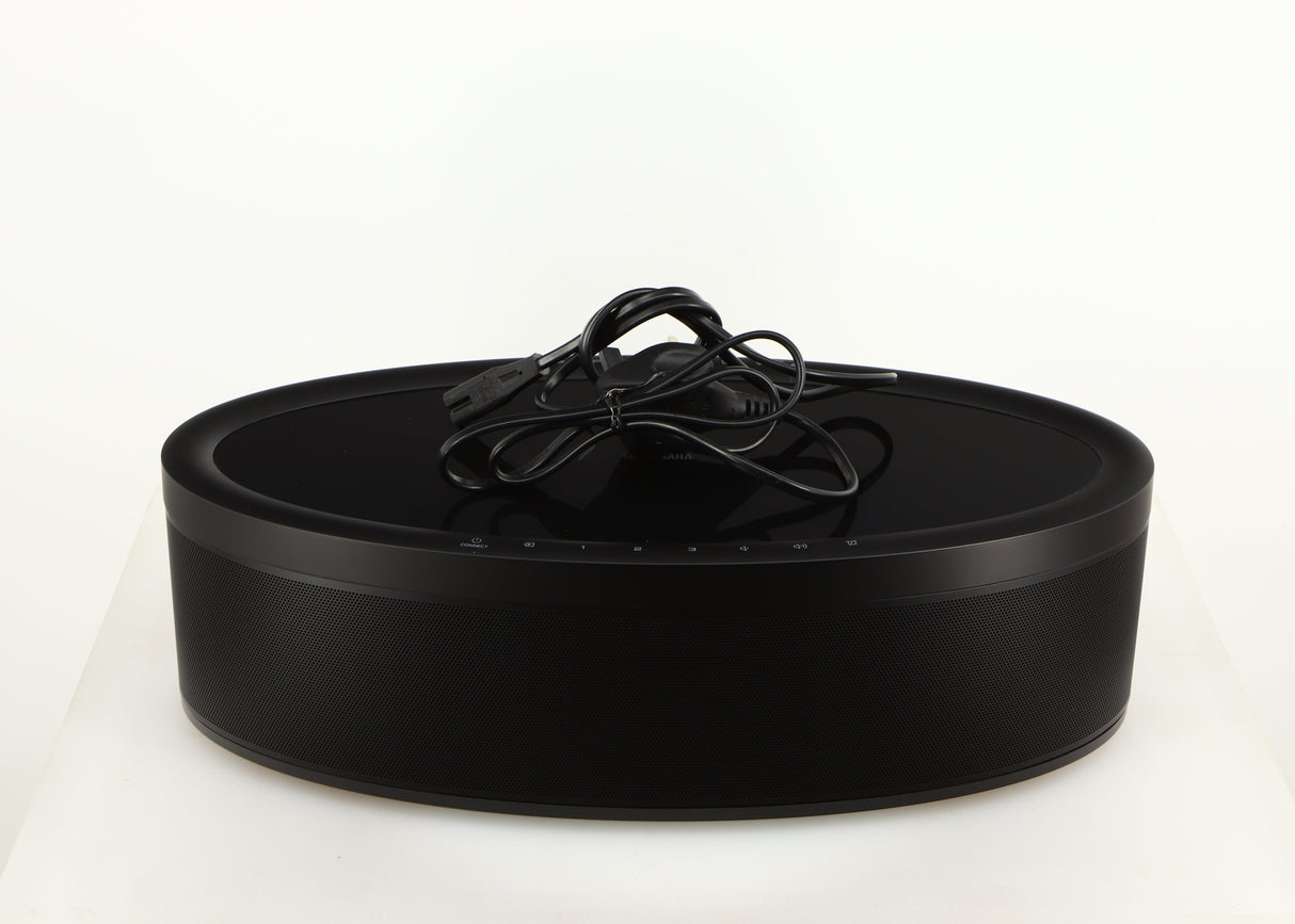 Top of a used Yamaha WX-051 Musicast Streaming Speaker in a black finish showing Power Cable