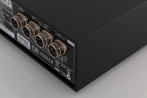 Rear left corner of a used Naim Hicap DR Power Supply in a Black finish