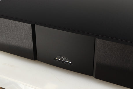 Close up of a used Naim CD555PS DR Power Supply in a black finish showing logo