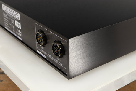 Rear left corner of a used Naim CD555PS DR Power Supply in a black finish