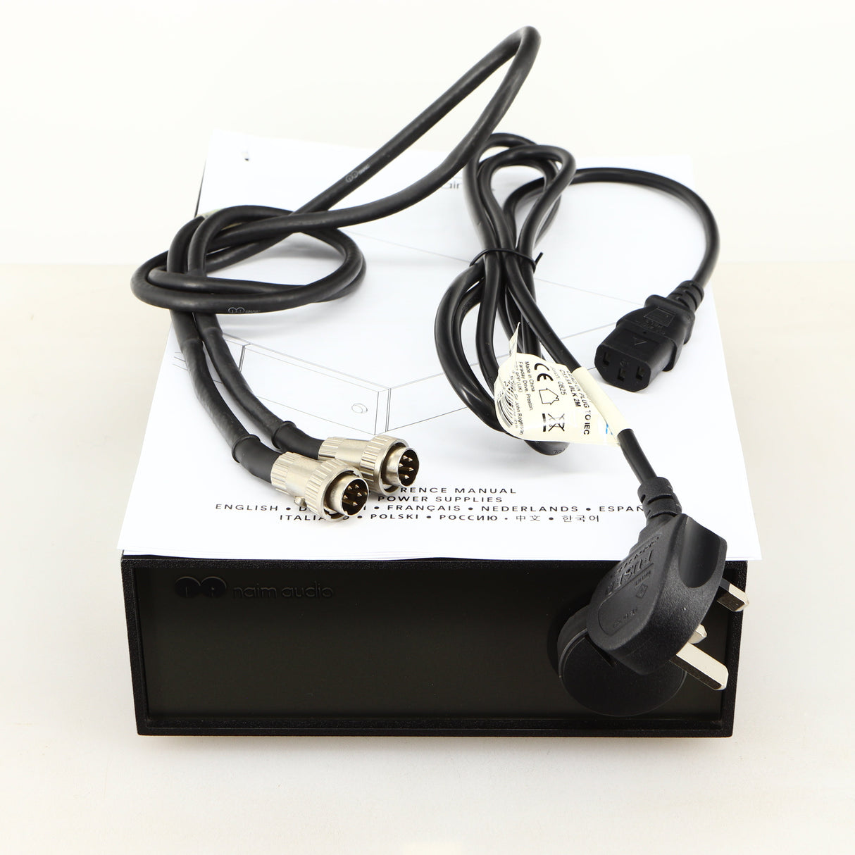 Top of a used Naim Hicap Power Supply in a black finish showing Mains Cable, SNAIC5 and Manual