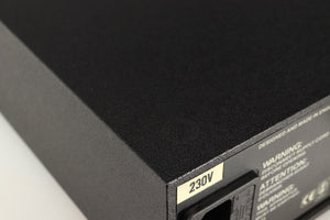 Close up of a used Naim Hicap Power Supply in a black finish showing foot mark on top