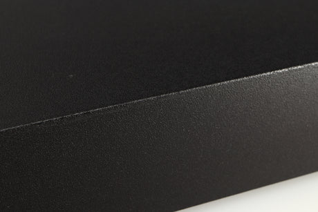 Close up of a used Naim Hicap Power Supply in a black finish showing mark on left side edge