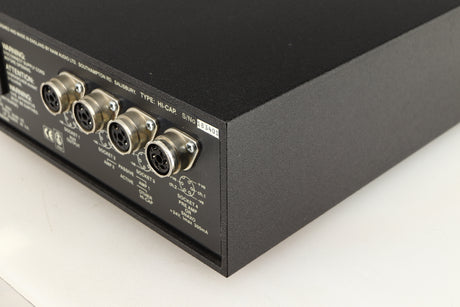 Rear left corner of a used Naim Hicap Power Supply in a black finish