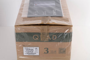 Box for a used Quad 303 Power Amplifier in a Silver finish showing Manual