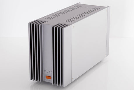 Front right corner of a used Quad 303 Power Amplifier in a Silver finish