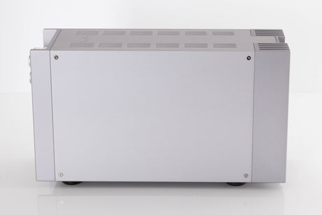 Left side view of a used Quad 303 Power Amplifier in a Silver finish