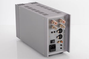 Rear right corner of a used Quad 303 Power Amplifier in a Silver finish