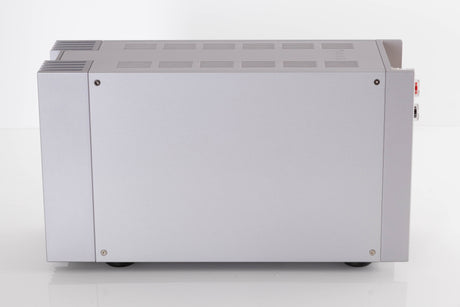 Right side view of a used Quad 303 Power Amplifier in a Silver finish