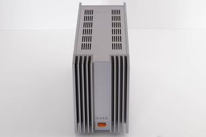 Top of a used Quad 303 Power Amplifier in a Silver finish